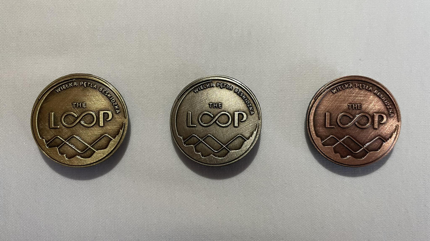 Odznaki przyznawane za przejście szlaku The Loop
